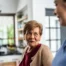 Caregiver provides attentive senior care as part of diabetes awareness