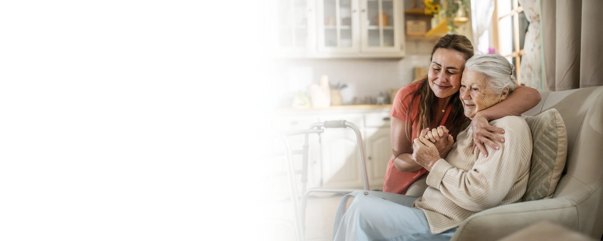 Caregiver hugging senior woman beside at home – Home Care Services in Munster, IN Caregiver hugging senior woman beside at home - Home Care in Munster, IN